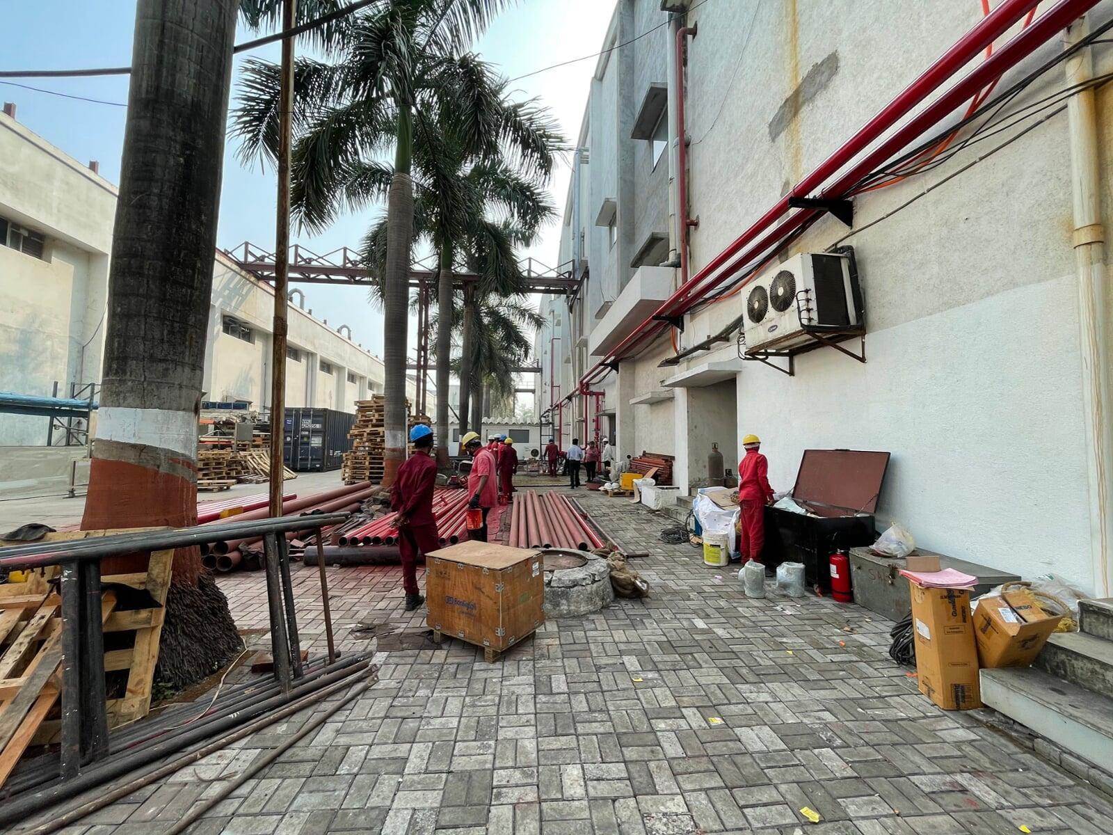 Technician repairing fire alarm system